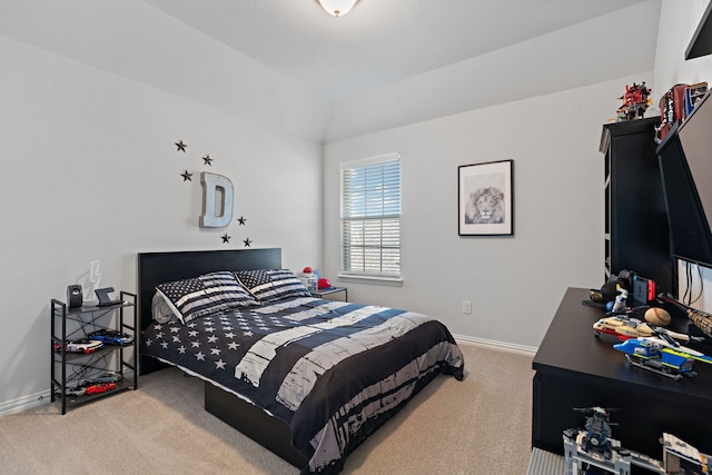 bedroom featuring carpet flooring and vaulted ceiling