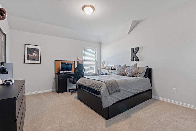 bedroom featuring light carpet