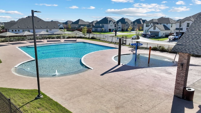 view of pool featuring pool water feature and a patio area