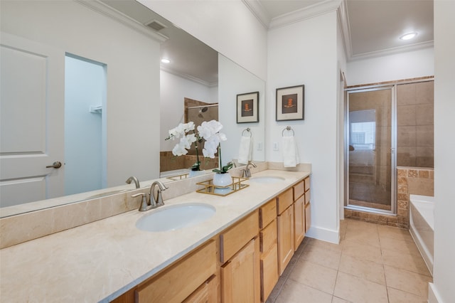 bathroom with vanity, tile patterned floors, ornamental molding, and separate shower and tub