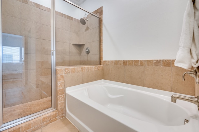 bathroom with separate shower and tub