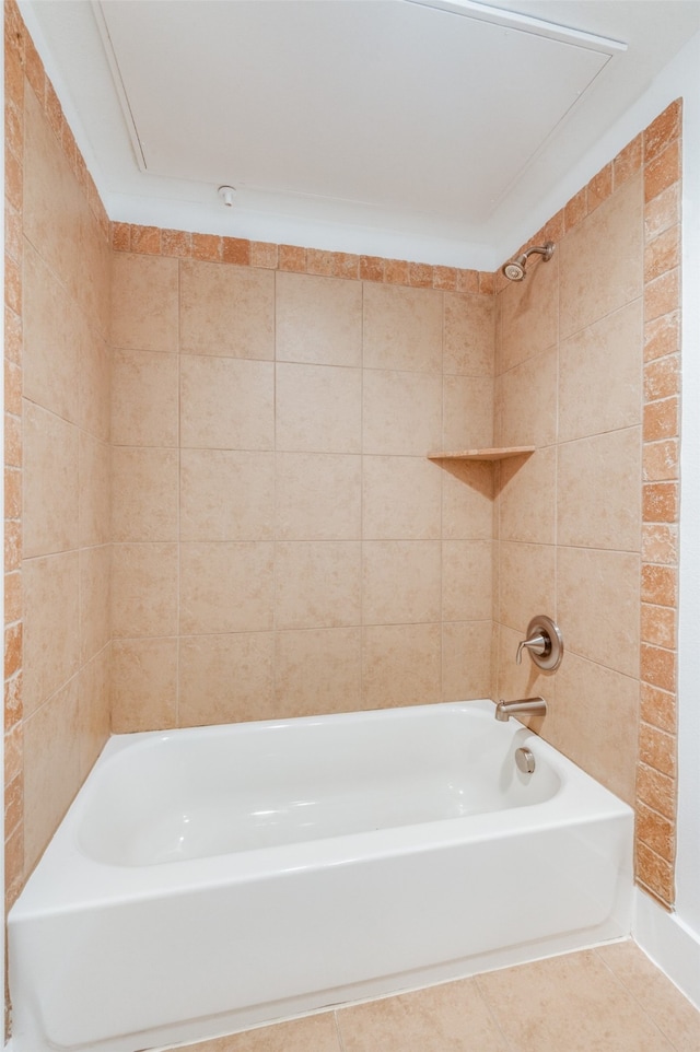 bathroom featuring tile patterned flooring and tiled shower / bath combo