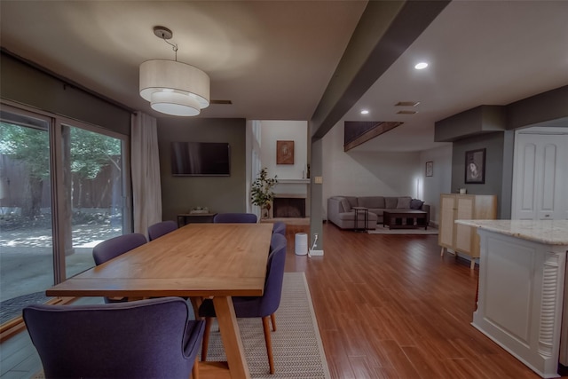 dining area with hardwood / wood-style floors