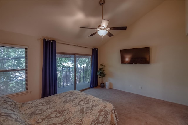 carpeted bedroom with access to exterior, ceiling fan, and vaulted ceiling