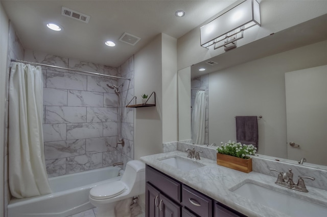 full bathroom featuring shower / bath combo, toilet, and vanity