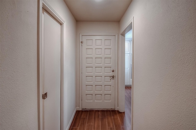 743 Oakwood Trl, Fort Worth, TX 76112 - entryway with baseboards, a textured wall, and wood finish floors