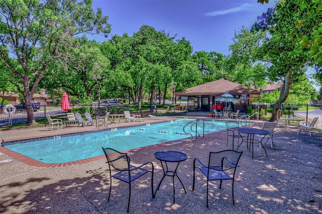 743 Oakwood Trl, Fort Worth, TX 76112 - pool with a patio area and fence