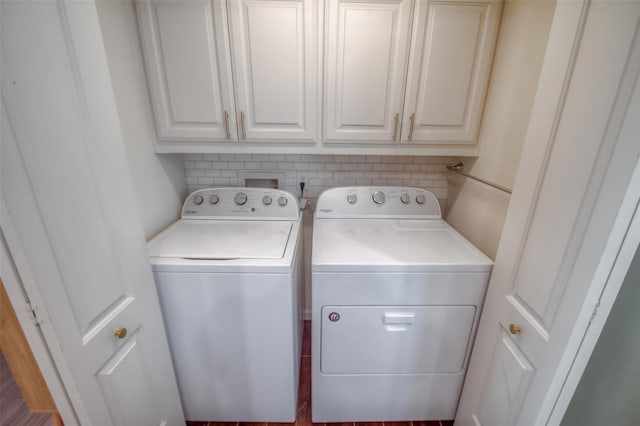 laundry area with cabinets and separate washer and dryer