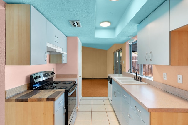 kitchen featuring white cabinetry, sink, a textured ceiling, stainless steel range with electric stovetop, and light tile patterned floors