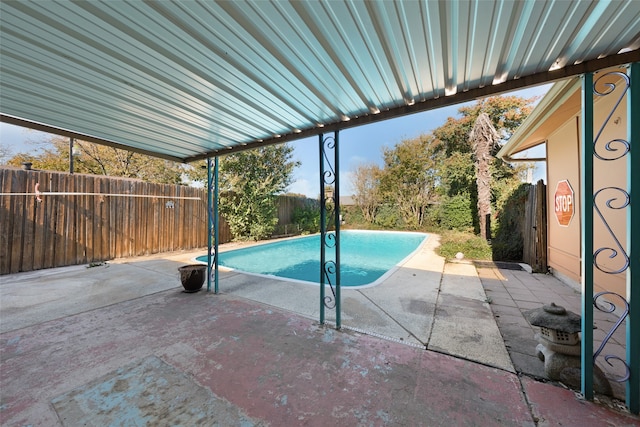 view of swimming pool featuring a patio area