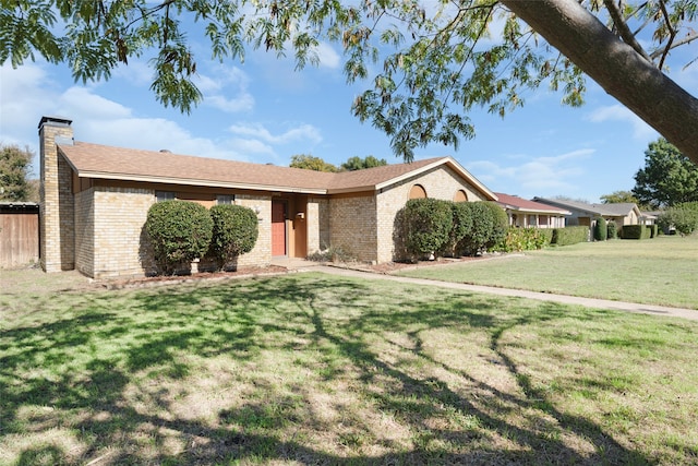 ranch-style house featuring a front lawn