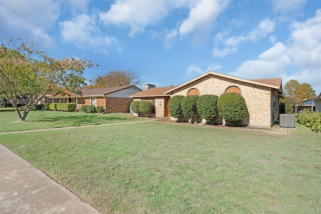 ranch-style house with central AC and a front yard