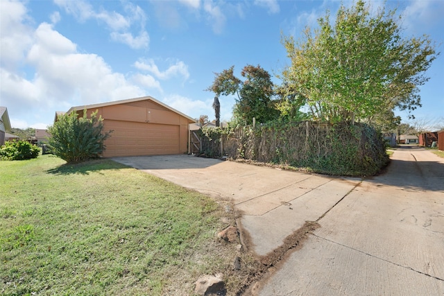 exterior space featuring a yard and a garage