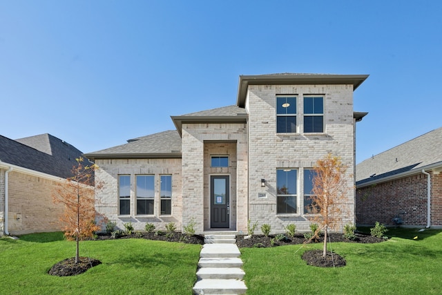 view of front of house with a front lawn