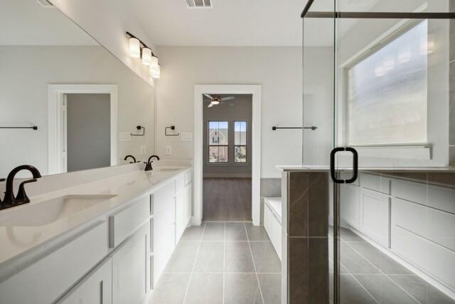 bathroom featuring tile patterned floors, ceiling fan, vanity, and separate shower and tub