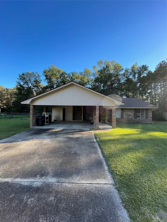 ranch-style house with a front lawn and a carport