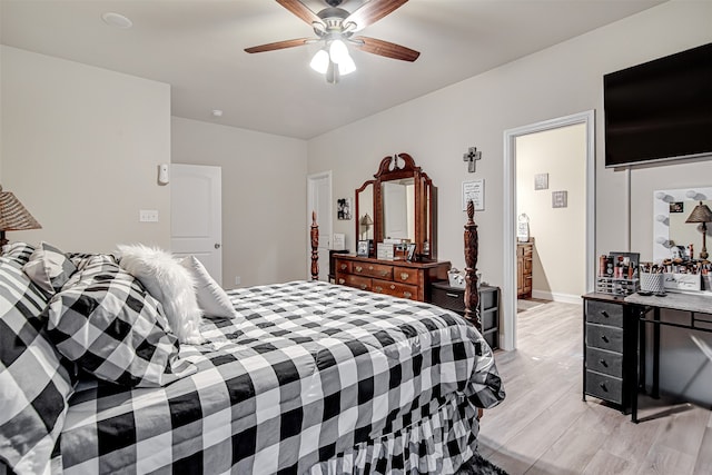 bedroom with ceiling fan and light hardwood / wood-style flooring