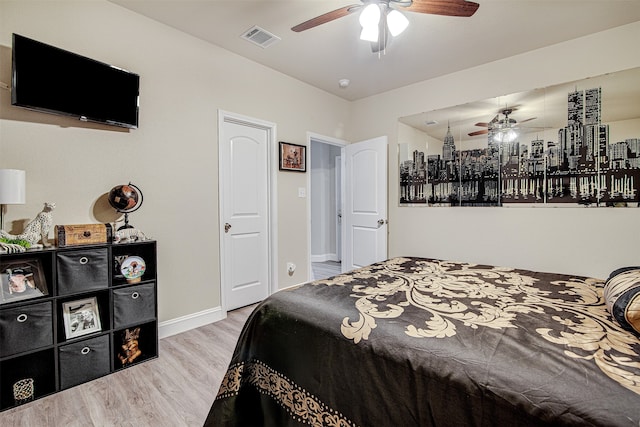 bedroom with light wood-type flooring and ceiling fan