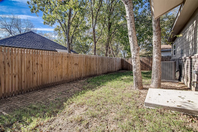 view of yard featuring cooling unit and a patio area