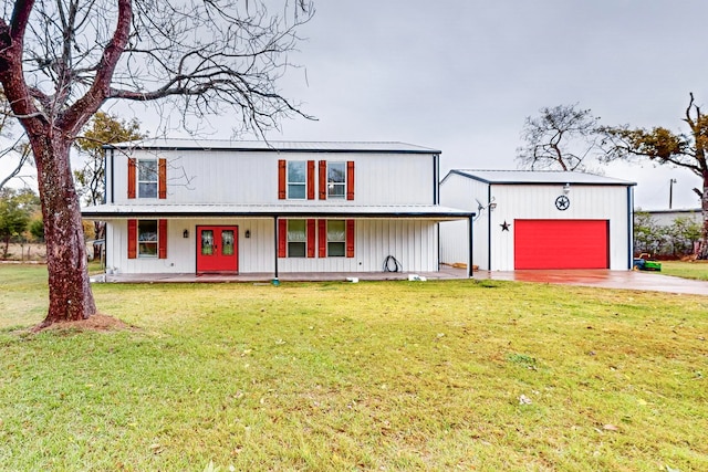 view of front facade with a front lawn, a porch, and a garage