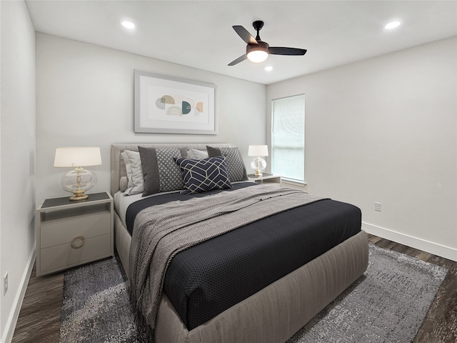 bedroom with ceiling fan and dark wood-type flooring