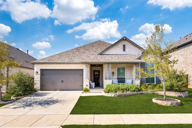 view of front facade with a front yard and a garage