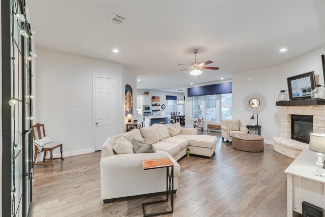 carpeted bedroom with visible vents, ceiling fan, and baseboards