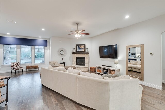 bedroom featuring baseboards, light colored carpet, and ceiling fan