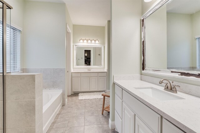 carpeted bedroom featuring a closet, baseboards, and a ceiling fan