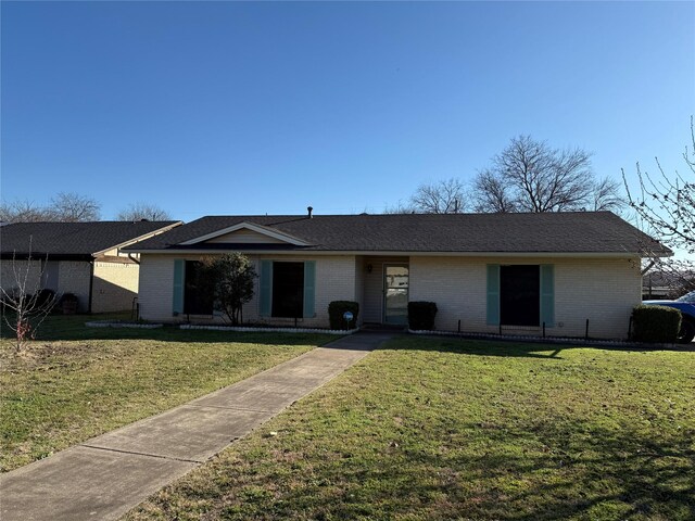 ranch-style house with a front lawn and central AC unit