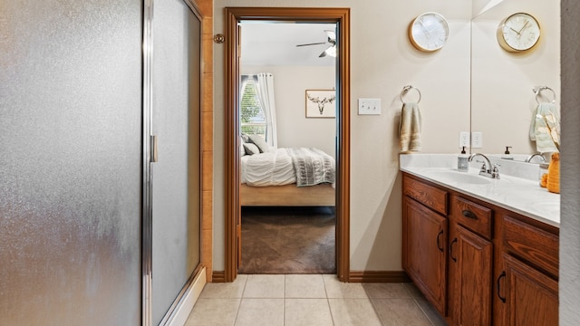 bathroom with tile patterned flooring, vanity, ceiling fan, and a shower with shower door