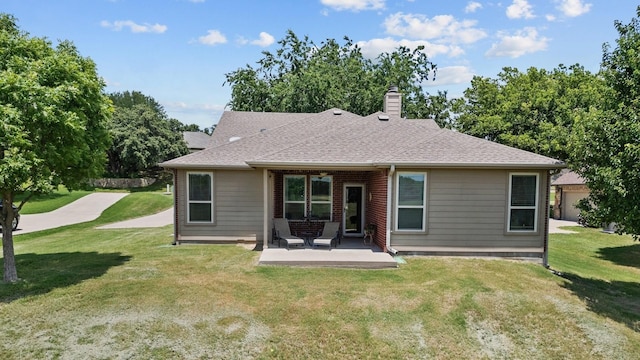 2045 Mason Pond Dr, Weatherford, TX 76085 - rear view of house featuring a patio, a chimney, a lawn, and a shingled roof