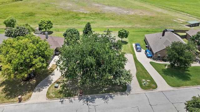 birds eye view of property with a rural view