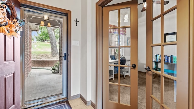 doorway with light colored carpet