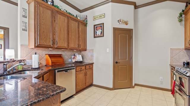 kitchen with sink, stainless steel appliances, backsplash, dark stone counters, and ornamental molding