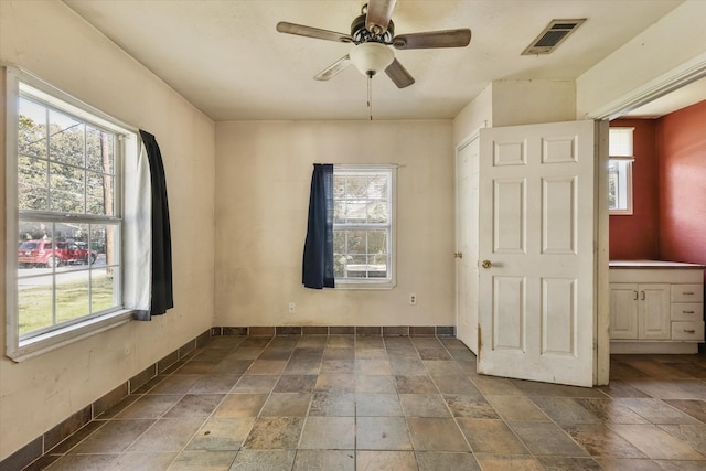 unfurnished room featuring ceiling fan