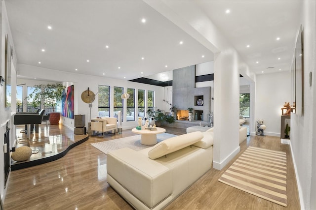 living room featuring a large fireplace