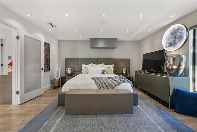 bedroom with light hardwood / wood-style flooring