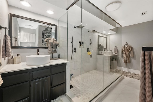 bathroom featuring vanity and a shower with shower door