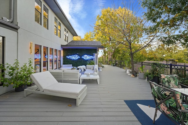 wooden terrace featuring an outdoor living space