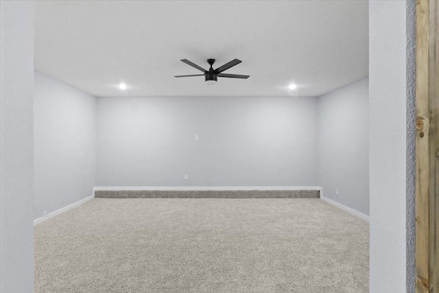 carpeted empty room with ceiling fan