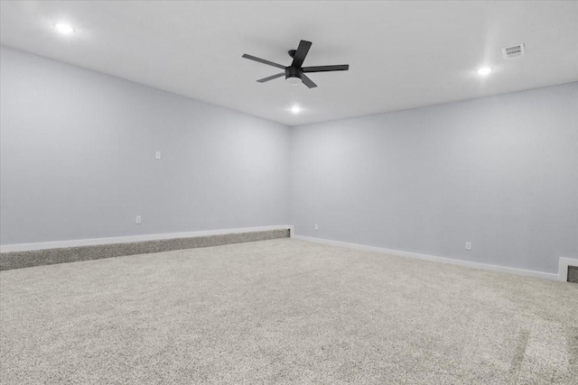 empty room featuring ceiling fan and carpet flooring