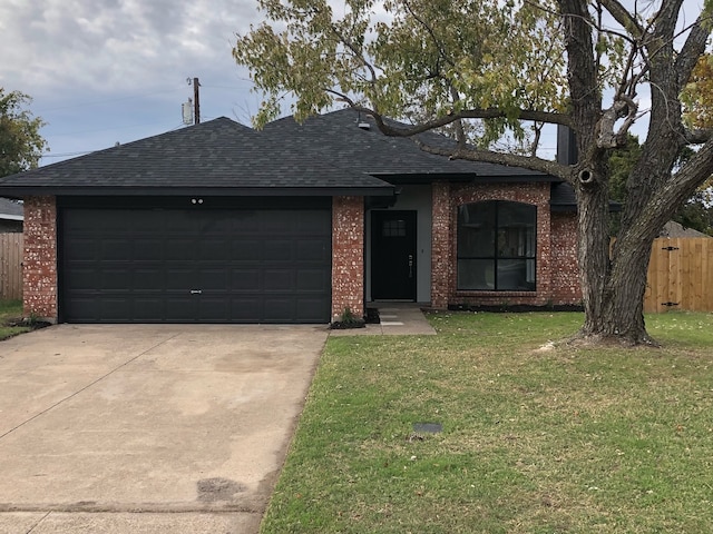 ranch-style house with a garage and a front lawn