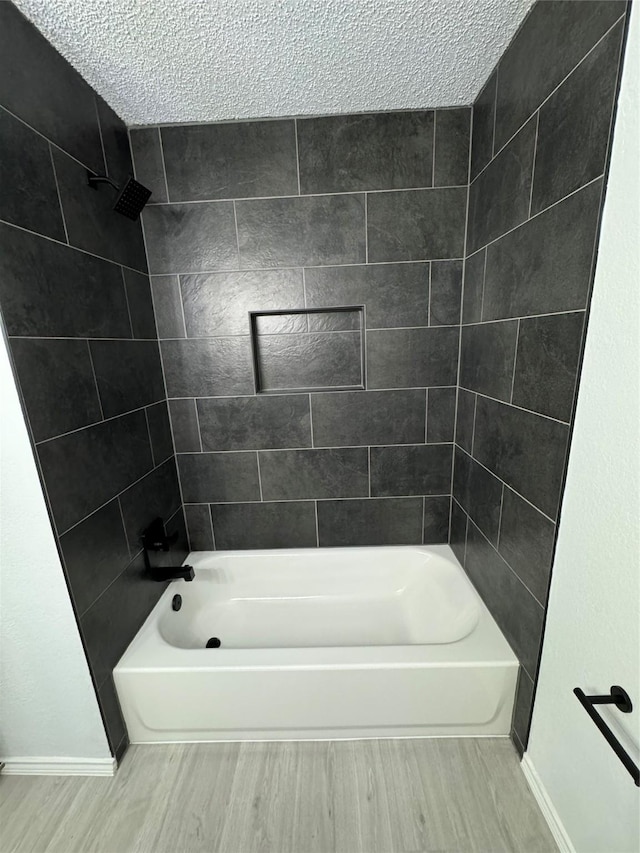 bathroom featuring shower / tub combination and wood-type flooring