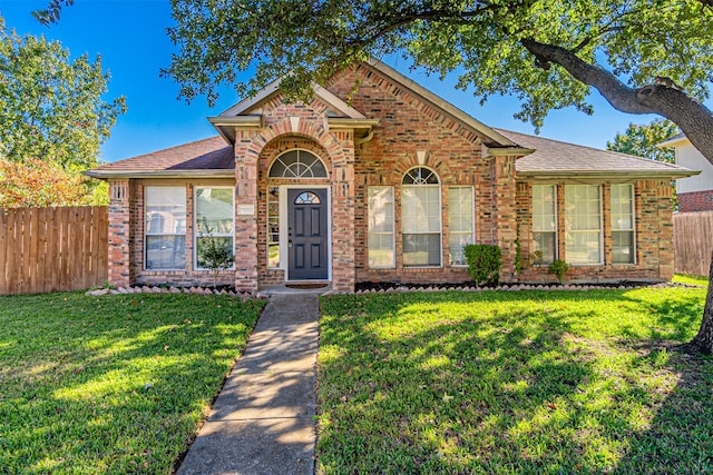 view of front of house with a front lawn