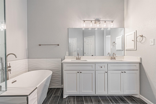 bathroom featuring a bathing tub and vanity