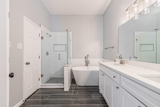 bathroom featuring vanity and plus walk in shower