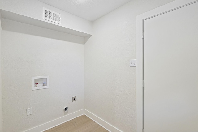 laundry room featuring hardwood / wood-style floors, washer hookup, and hookup for an electric dryer