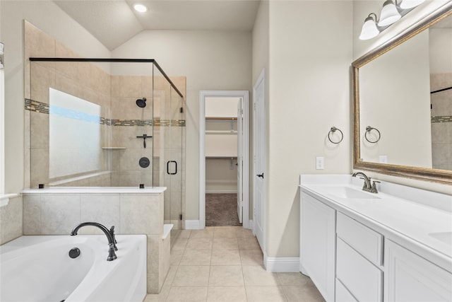 bathroom featuring tile patterned floors, vanity, plus walk in shower, and vaulted ceiling