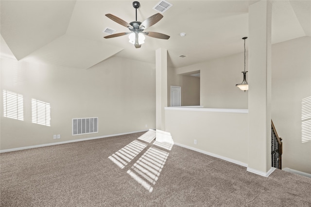 unfurnished living room with ceiling fan, carpet floors, and vaulted ceiling